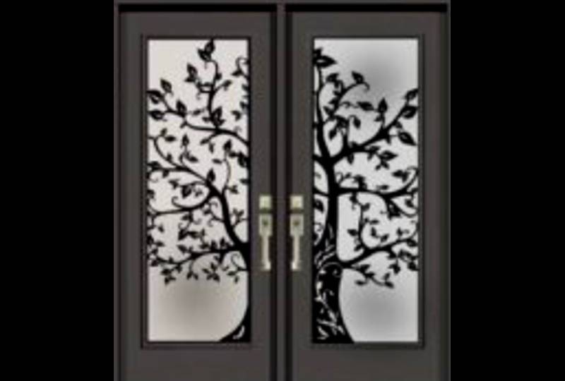 Decorative doors with intricate tree design.